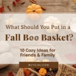 Fall Boo Basket flat lay with mini pumpkins, candle, mug, slippers, and cozy blanket – 10 gift ideas for friends, family, and neighbors | Buysuki.com